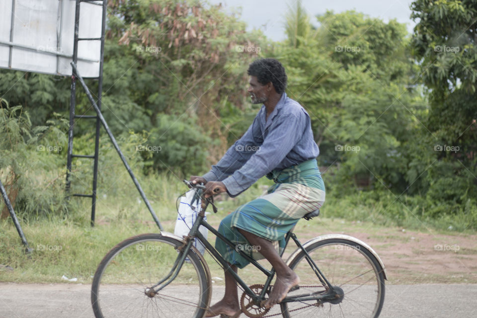 old man riding a bike