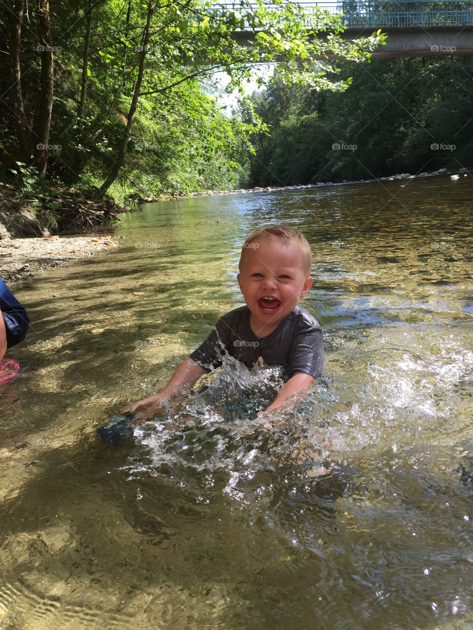 Very happy baby playing in the river for the first time 