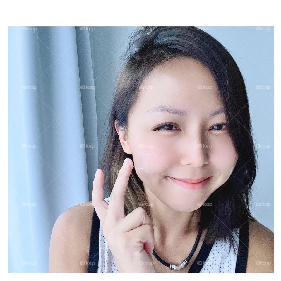 Asian woman using kbeauty products 