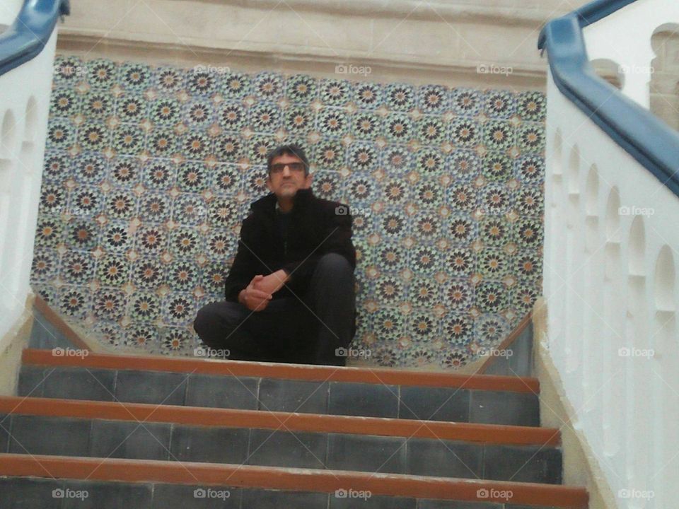 Im sitting againt zellij in a  meusem in essaouira city in Morocco