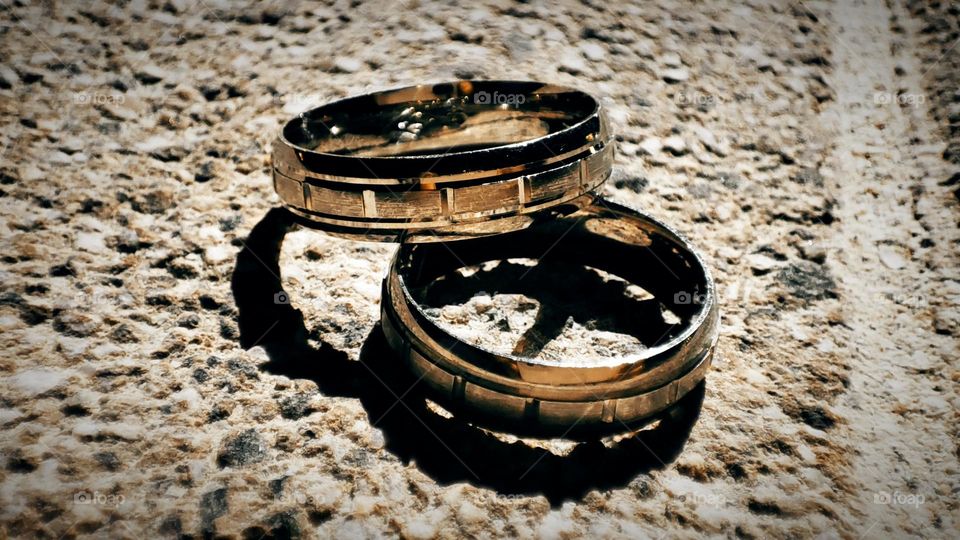 Wedding rings are a symbol of love, unity, and a bond between two people. It's a label, a sign, warning of some sort....