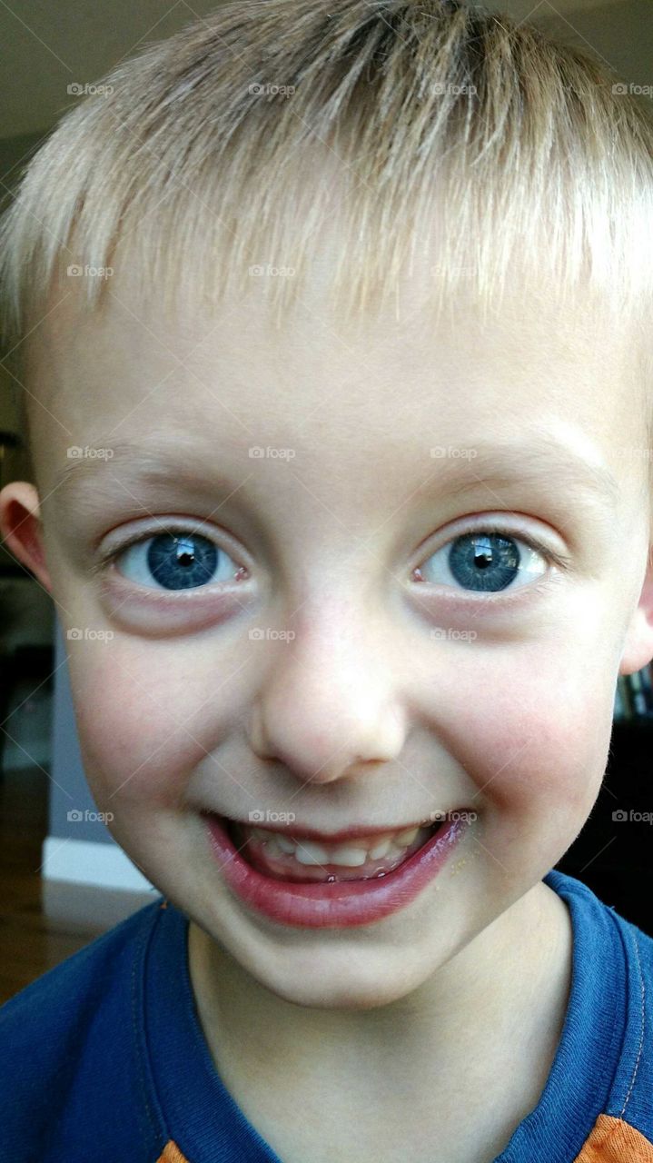 cute blue eyed smiling boy