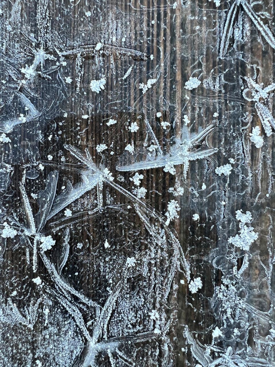 Ice on a bench in switzerland