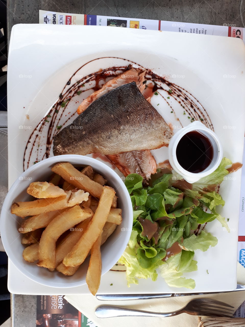 Plate with fish, salad and French fries