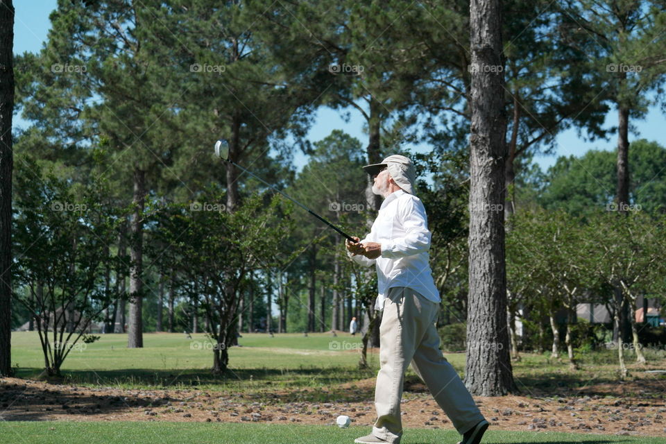 Man playing golf