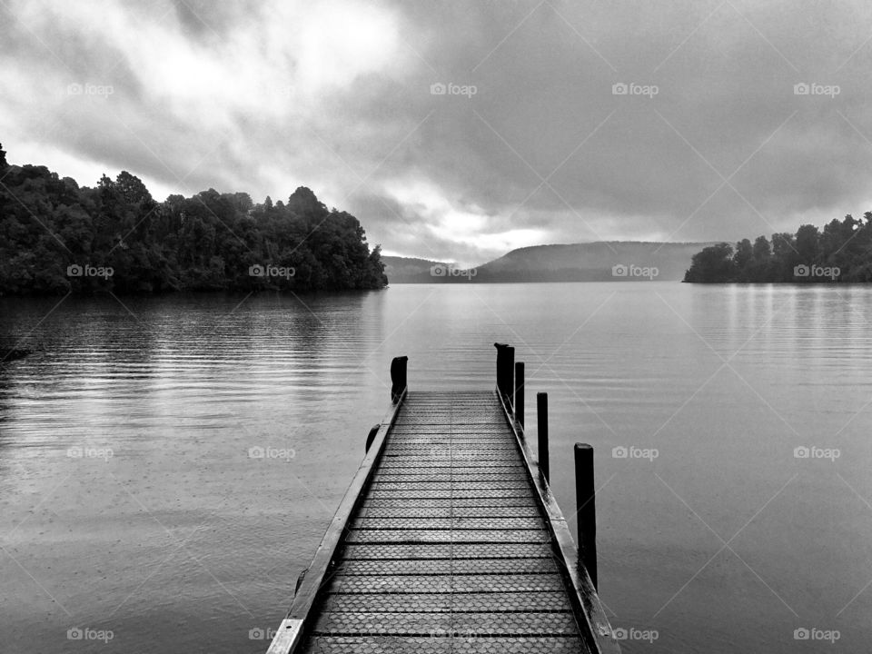 Timber pier in winter jutting out into a lake, New Zealand 