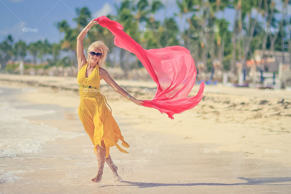 Beautiful Portraits in motion on the beaches of Punta Cana in the Dominican Republic. This model was from the country of Ukraine. Blending the vibrant yellow and pink colors and putting it all in motion set this set of shots apart from many.