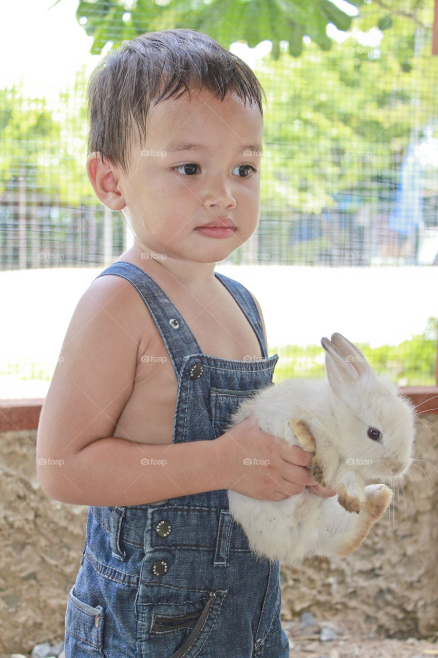 Kid with rabbit