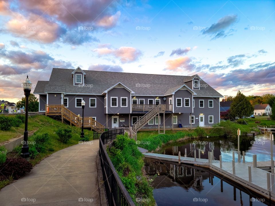 building by the lake at sunset