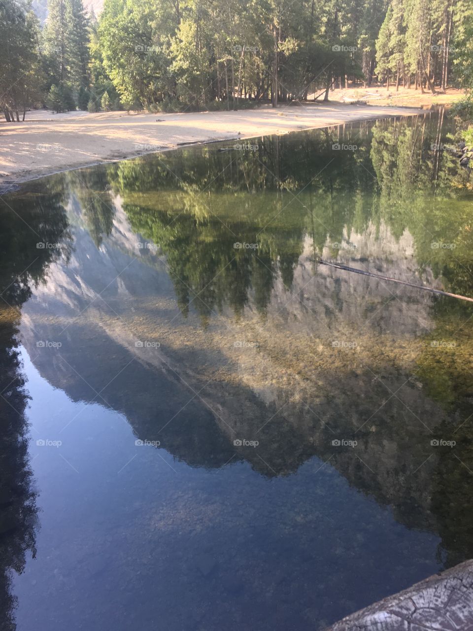 Reflections of mountain on the river