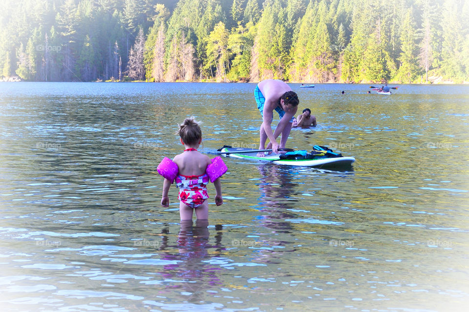 Paddle boarding at the lake. Paddle boarding at the lake