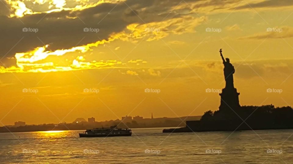 I took this photo of Lady Liberty at sunset while onboard the Staten Island Ferry!