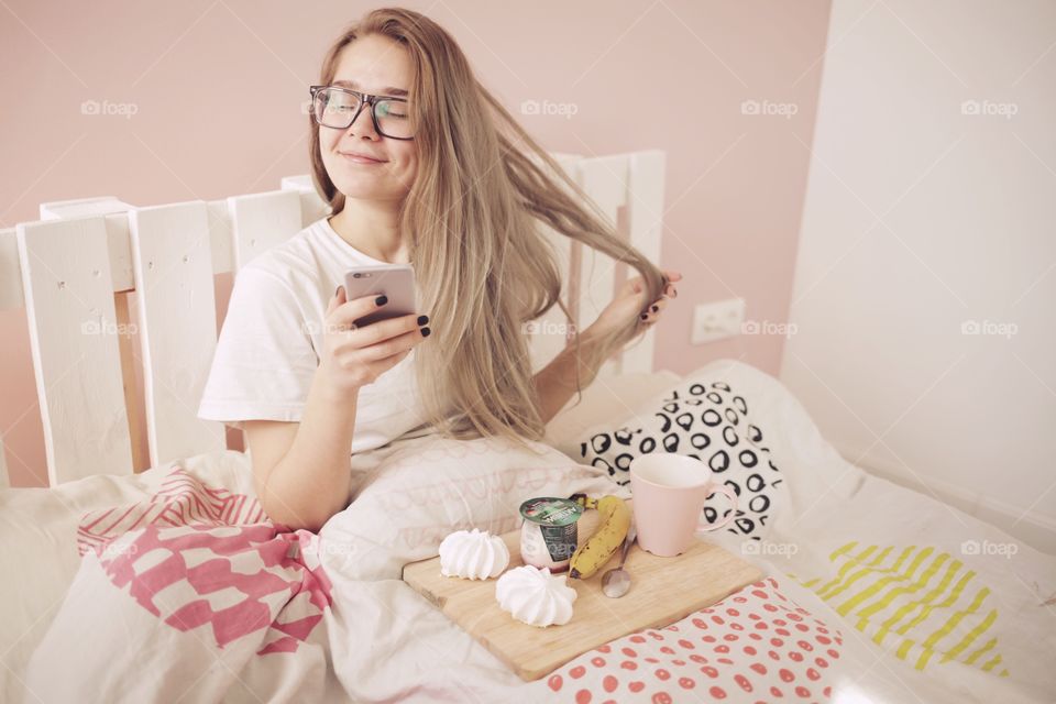 Girl smiling in bed