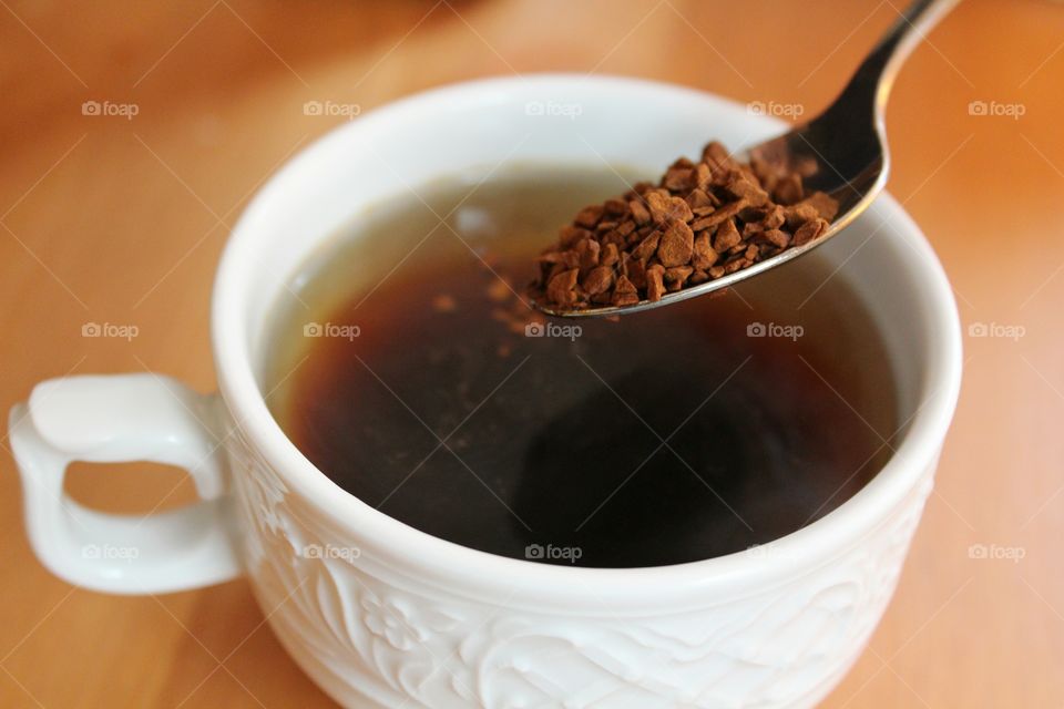 coffee granules falling down to the cup