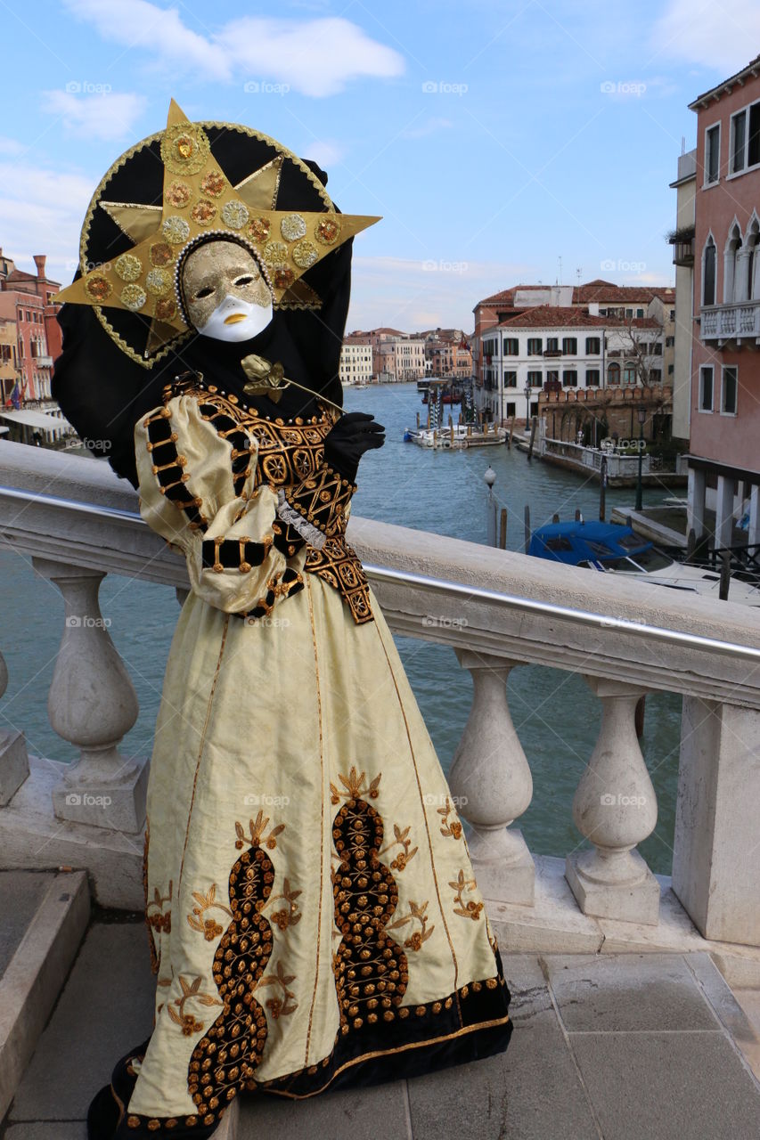 Woman holding mask in italy
