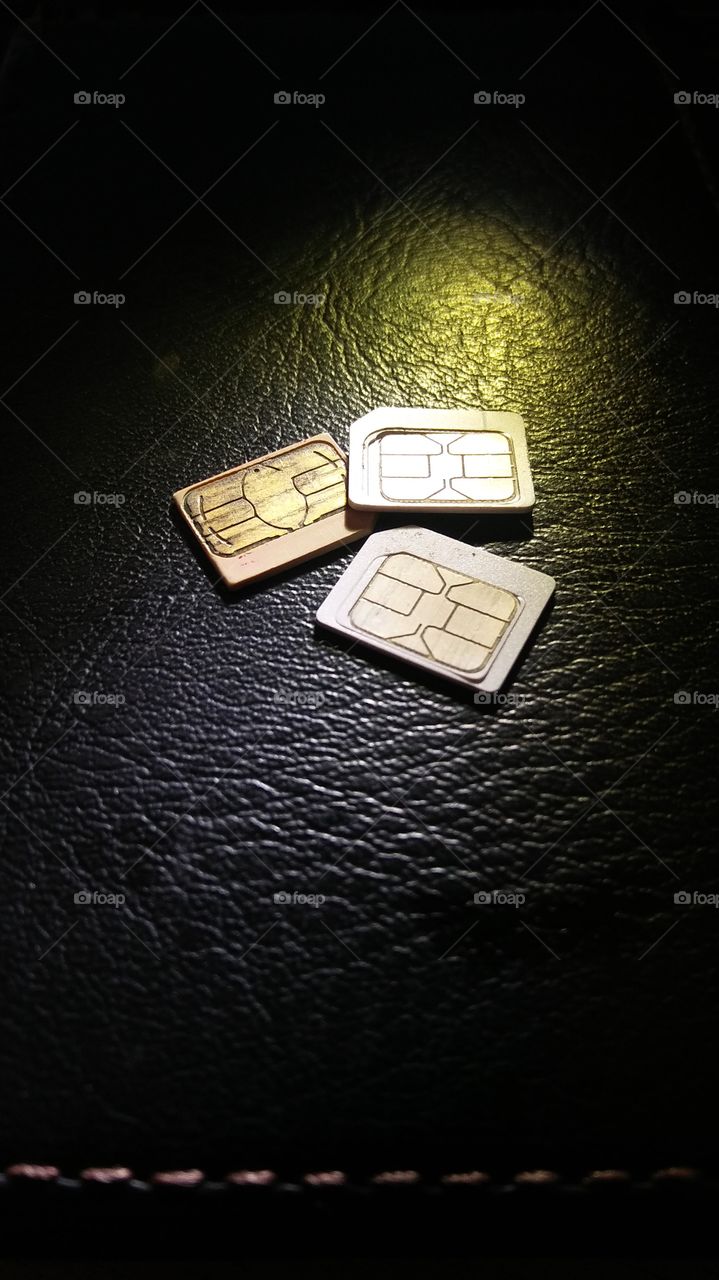 Three Sim card on the top of briefcase