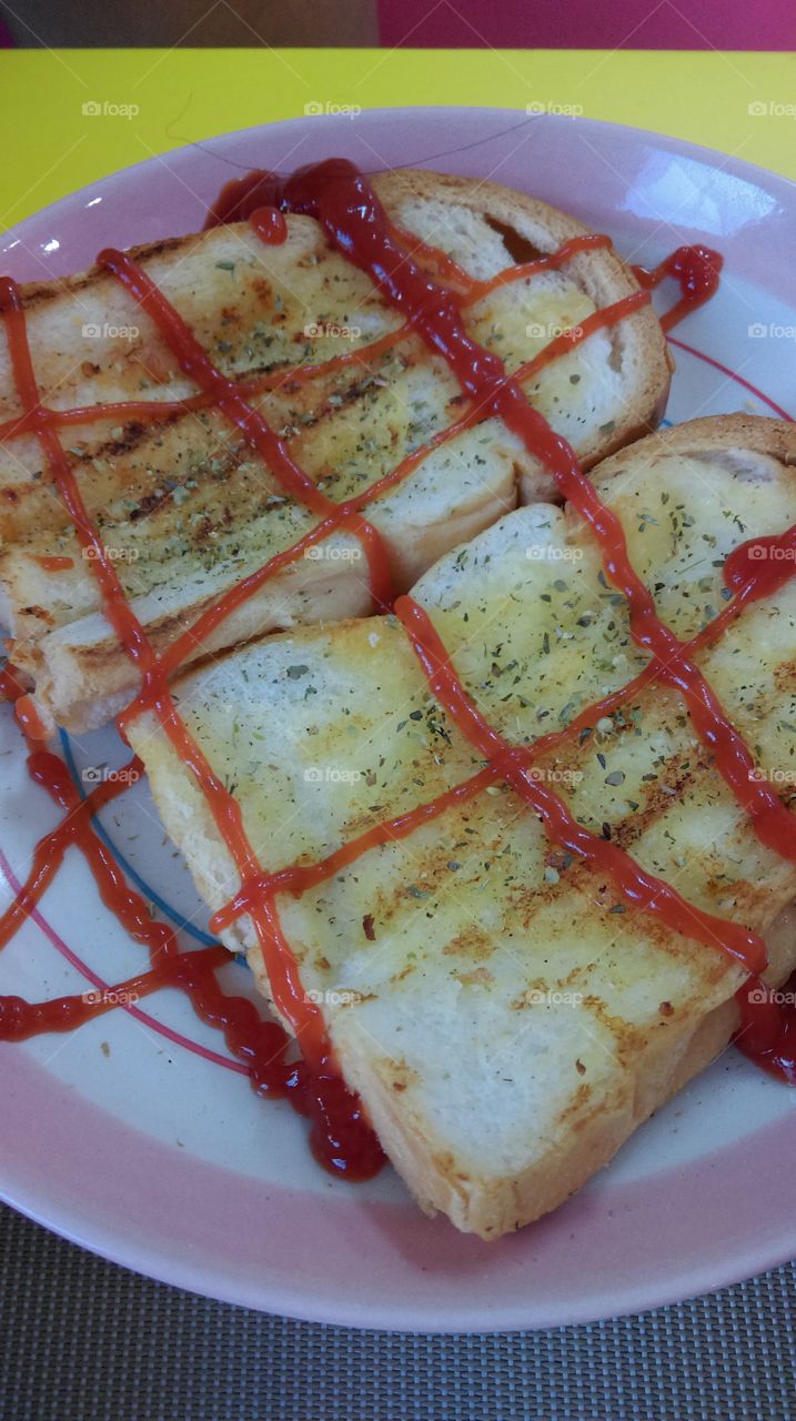 Garlic bread with red sauce.