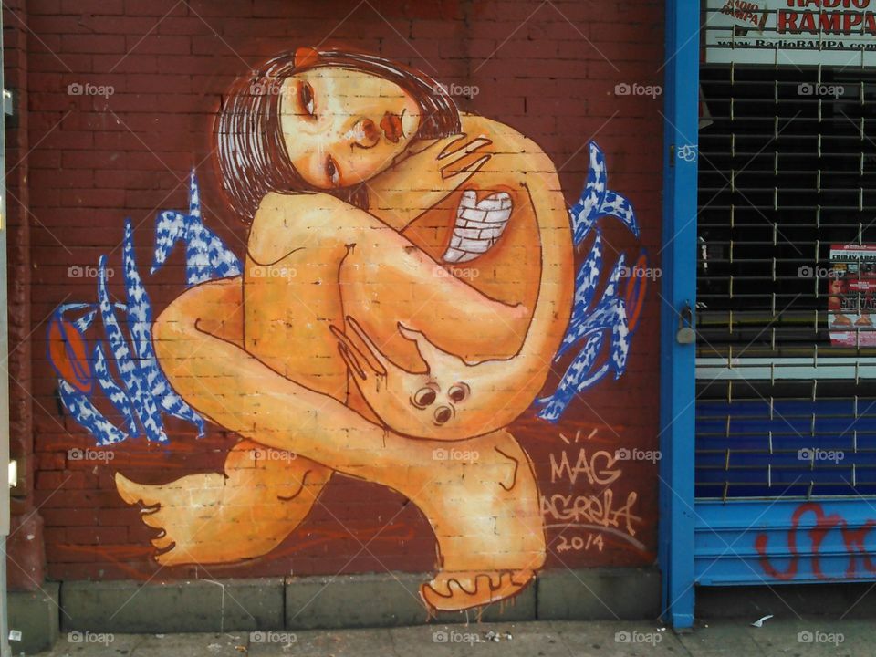 Free of the soul. on my street, their is this lovely picture of a girl being free of nature on a wall