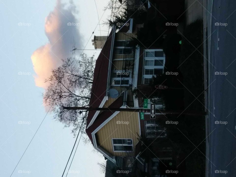 house cloud above trees surreal