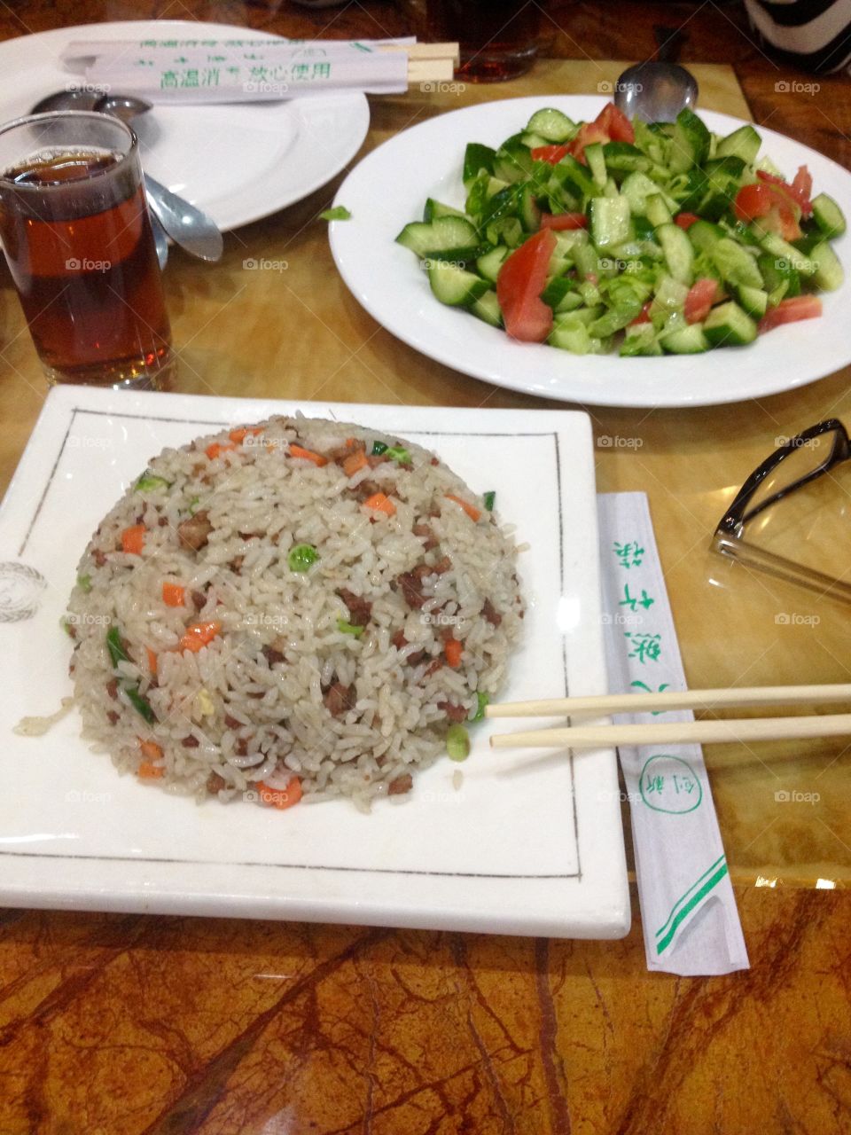 Dinner of rice with vegetables and a salad in a restaurant 