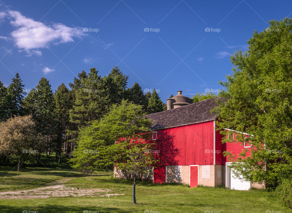 Red barn on a sunny day in Wisconsin. Red barn in Wisconsin on a sunny day