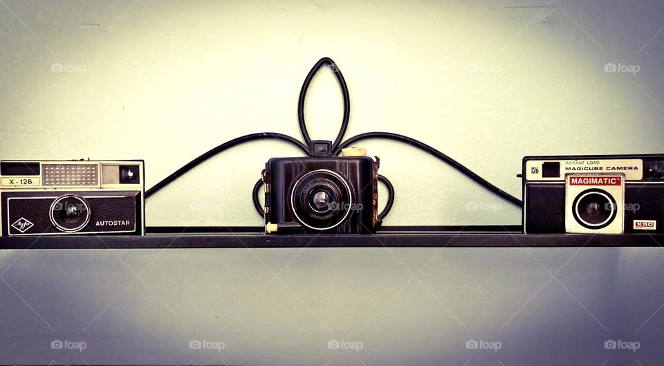 Vintage cameras posing for a photo.