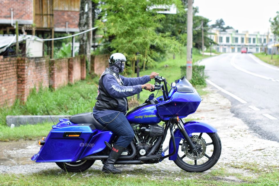 Blue Harley Davidson and rider