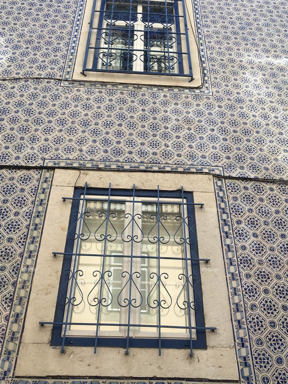 Typical azulejos wall with mesh windows
