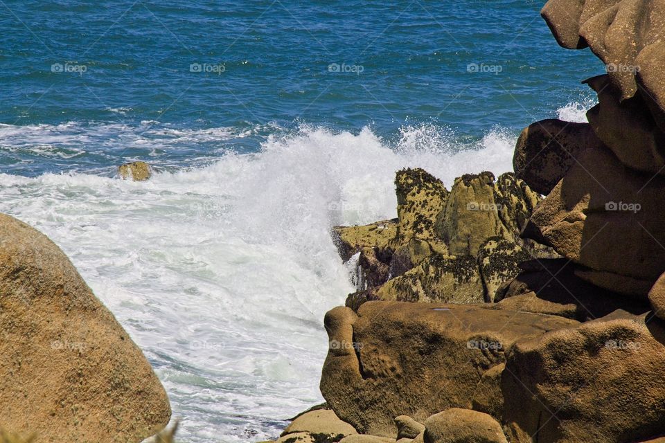 waves crashing on rocks