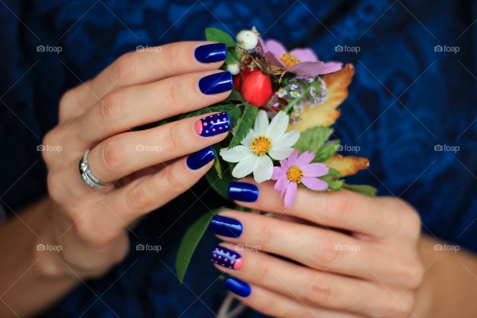 A hand holding beautiful flowers