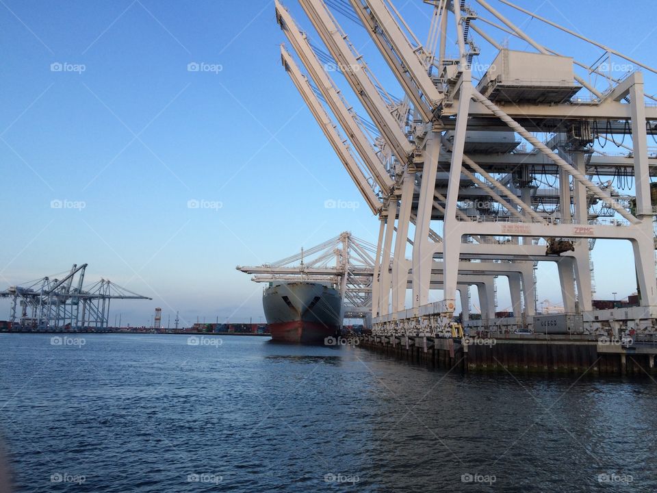 Port of Long Beach cargo ship and cranes 