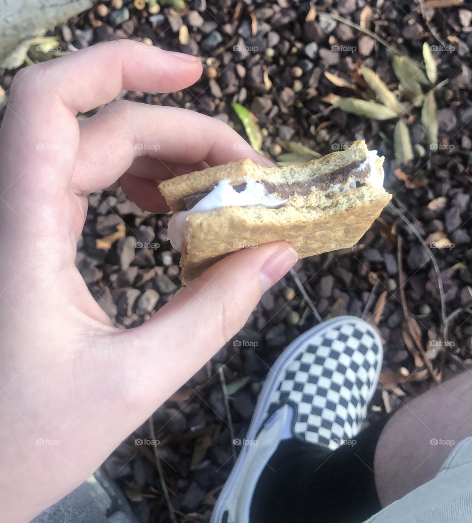 s'mores outside checkered vans family time autumn chilly outside outdoors hand closeup