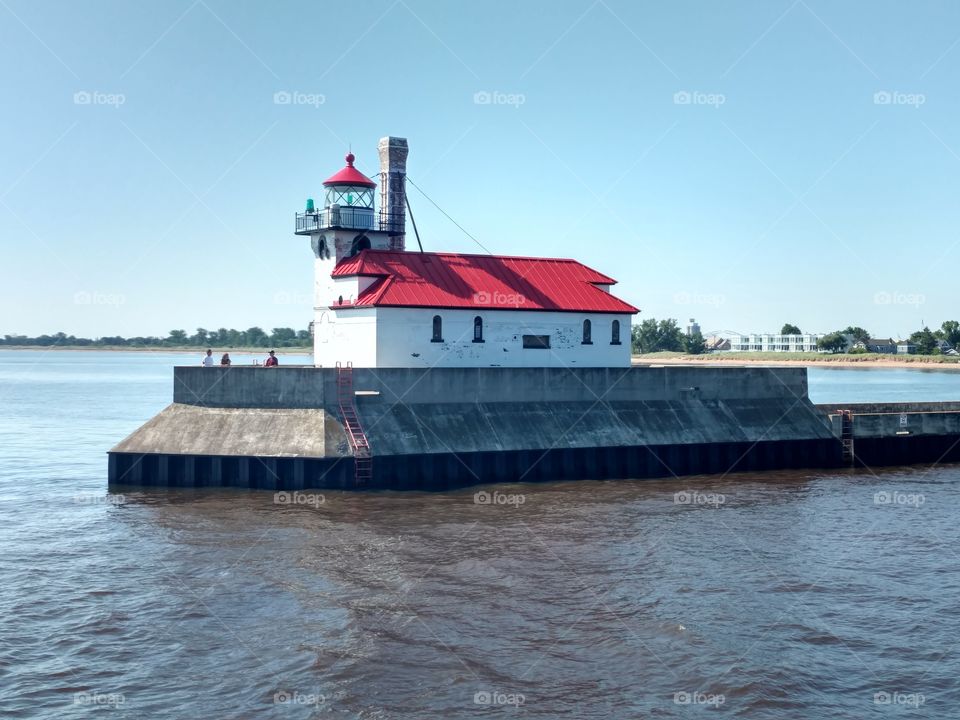 Lighthouse on Lake Superior summer time pier