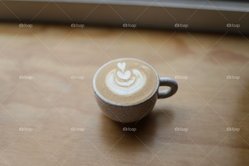Cappuccino in soft window light. 