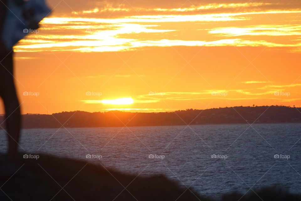 brazilian sunset. sunset in salvador, brazil at farol de barra