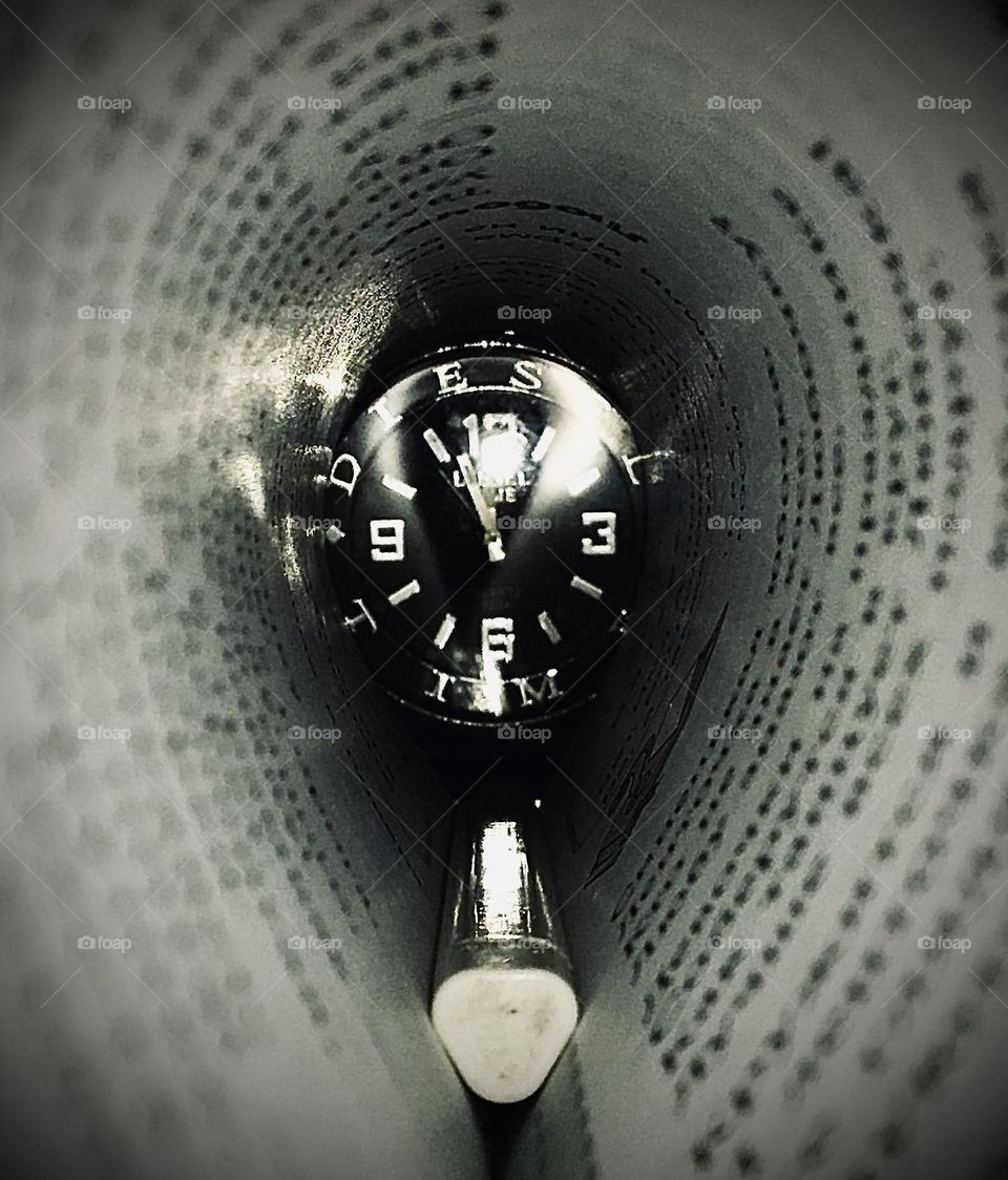 Pencil and clock inside the book. beautiful combination