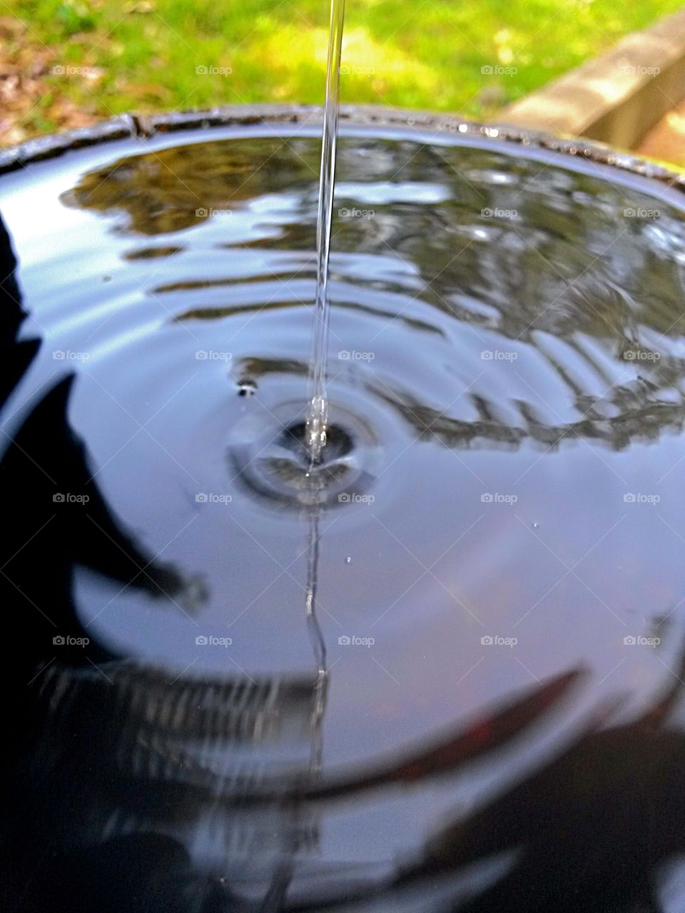 water in motion by a fountain