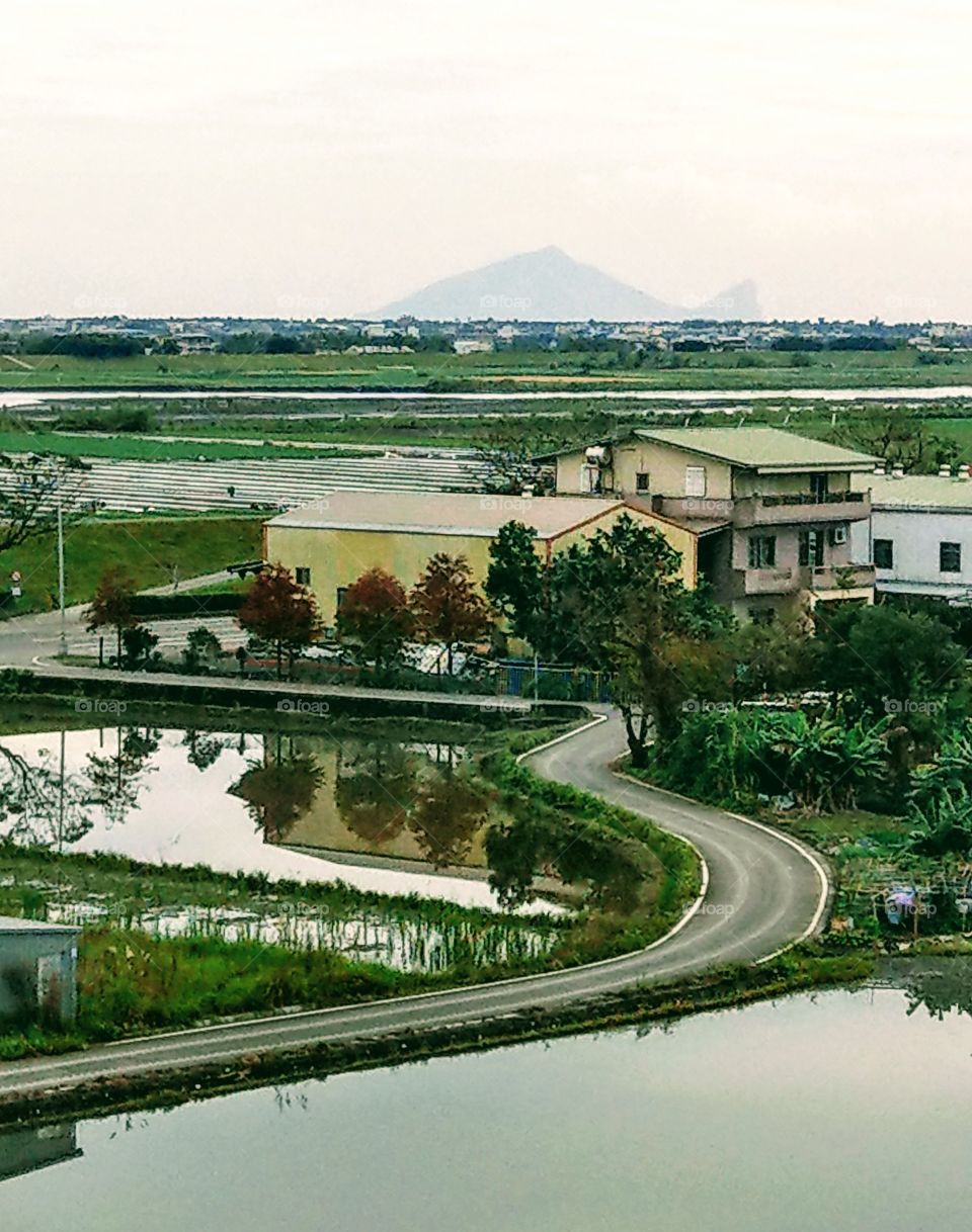 silent spring morning of countryside,
there is  a turtle-moutain island in the
distance. how peaceful this landscape!