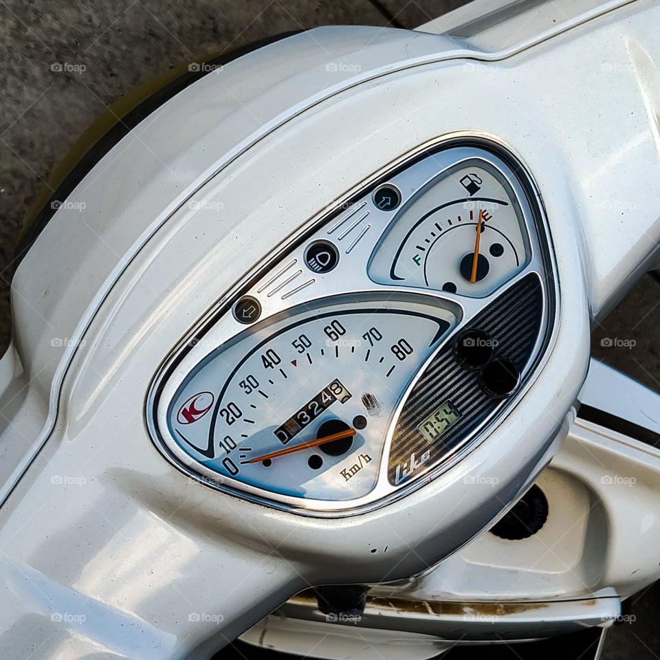White Vespa scooter meters