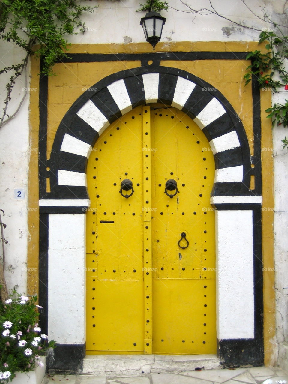 Yellow door. It's always an exciting question: Who lives behind a door and which story could be told?  Seen in Tunisia.