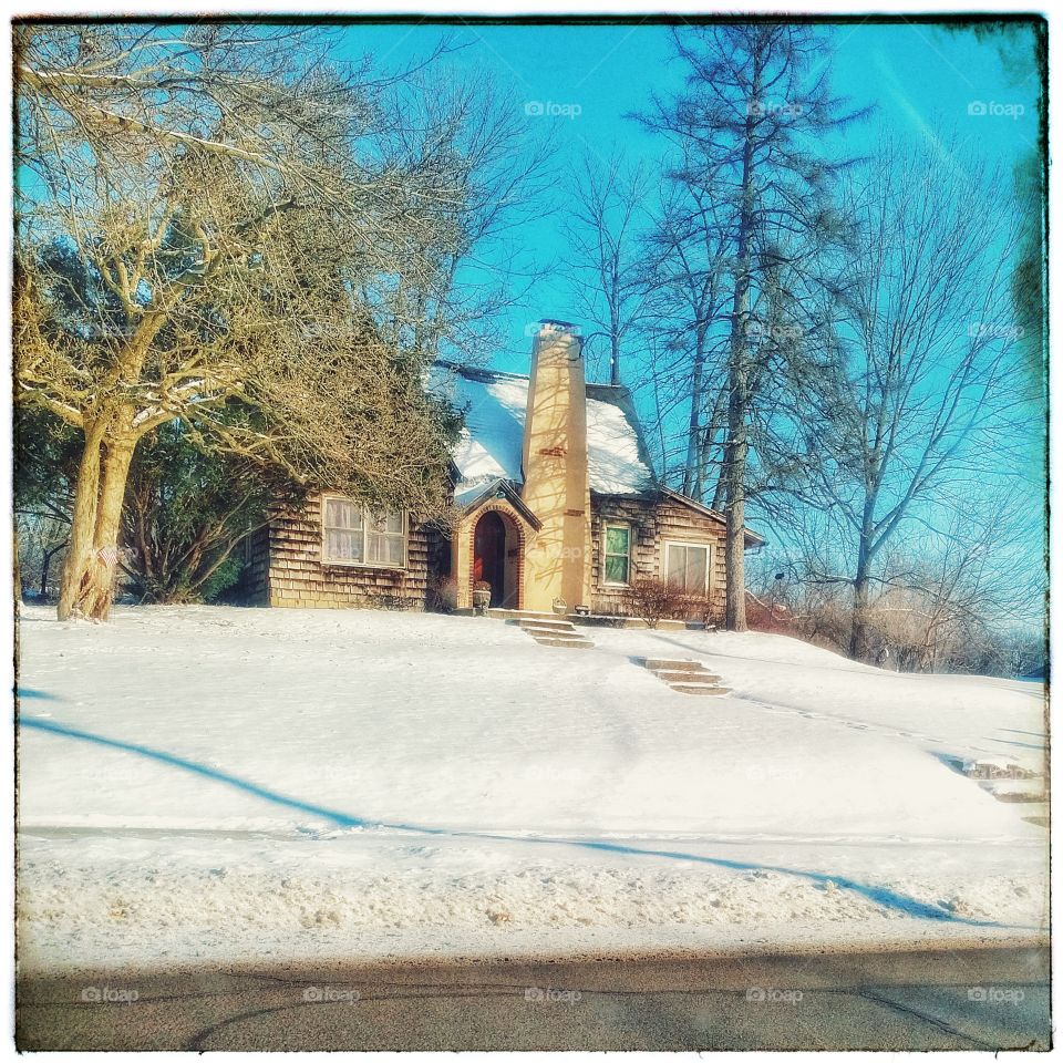 Snow covered old home
