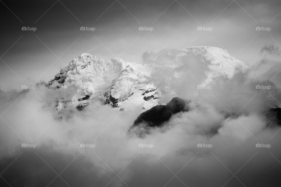 snow white mountain with clouds