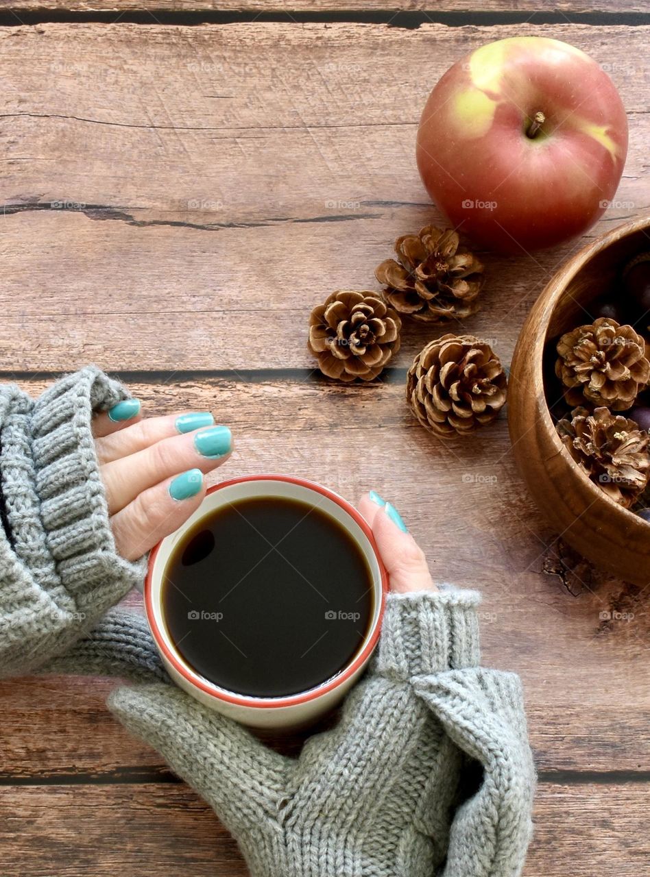 Hot coffee in winter autumn setting 