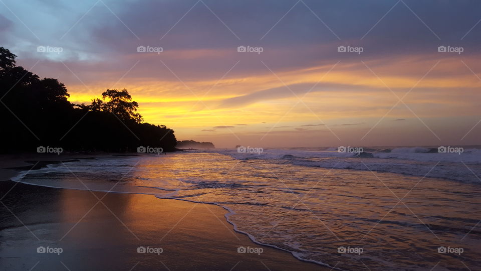 Surf at beach in the evening