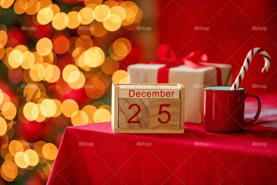 Christmas background with wooden block calendar with the date of December 25