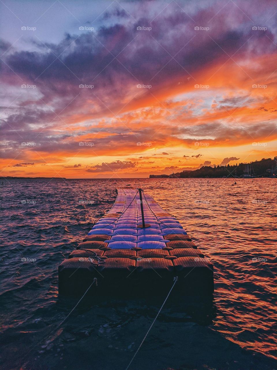 Scenic view of amazing red sunset sky at Adriatic sea.  Slovenia.  Travel.  Summer vacation.  Magenta color