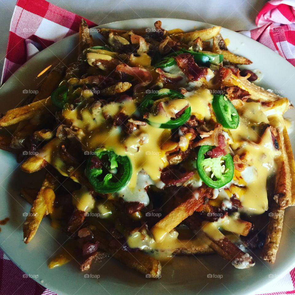 Chilli cheese fries with Bacon and jalapeños.