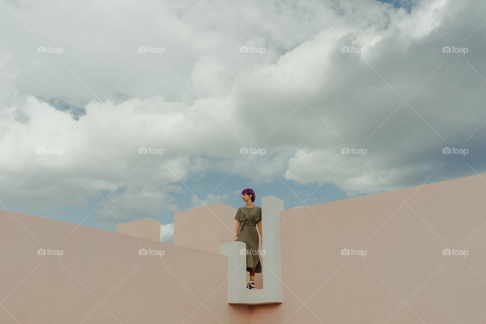 Girl staying among the clouds