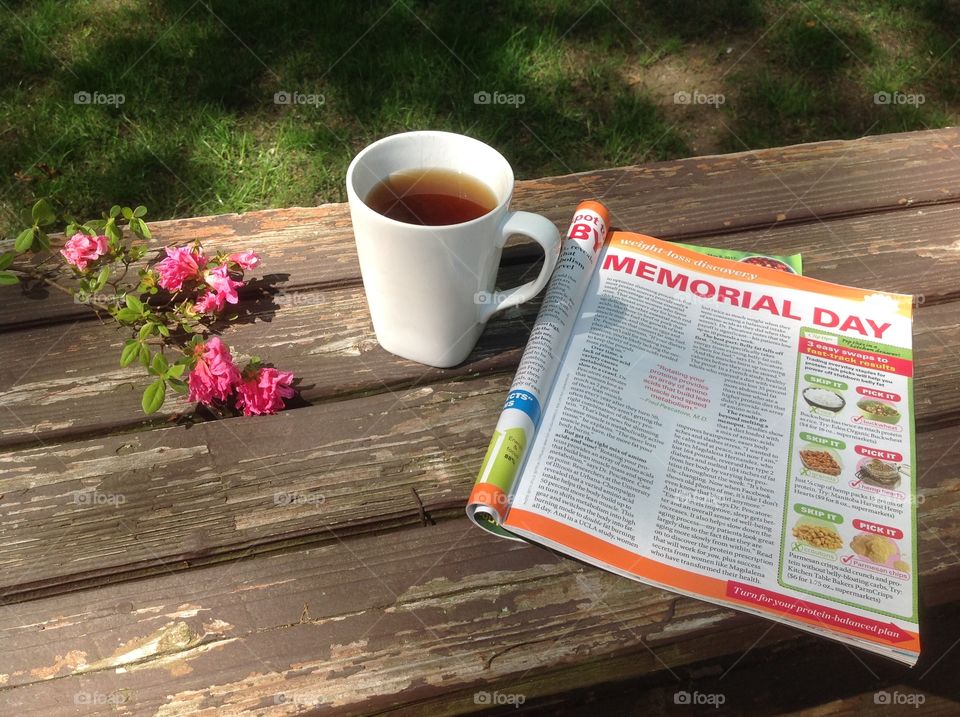 Enjoying a cup of coffee on a beautiful spring day outdoors.