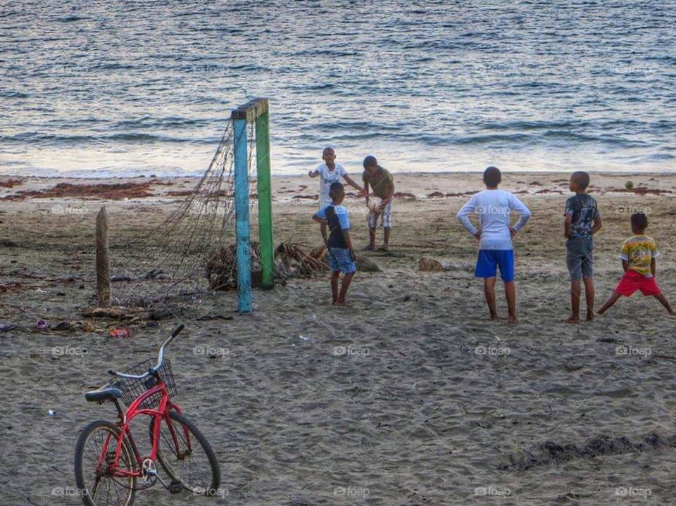 Playing soccer on the beach